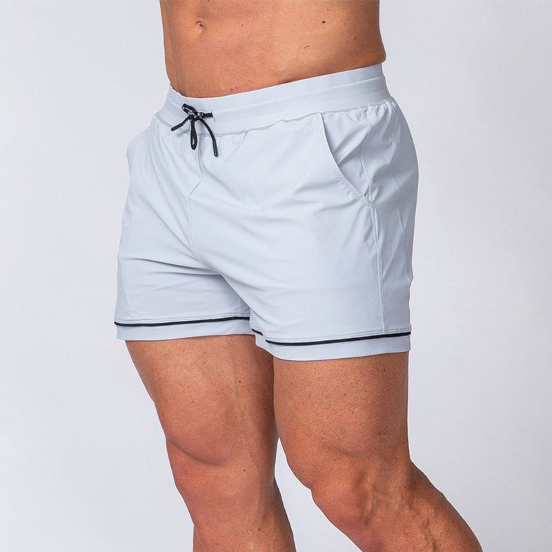 Quick-drying sport running shorts in white, elastic waistband with drawstring and dark cord